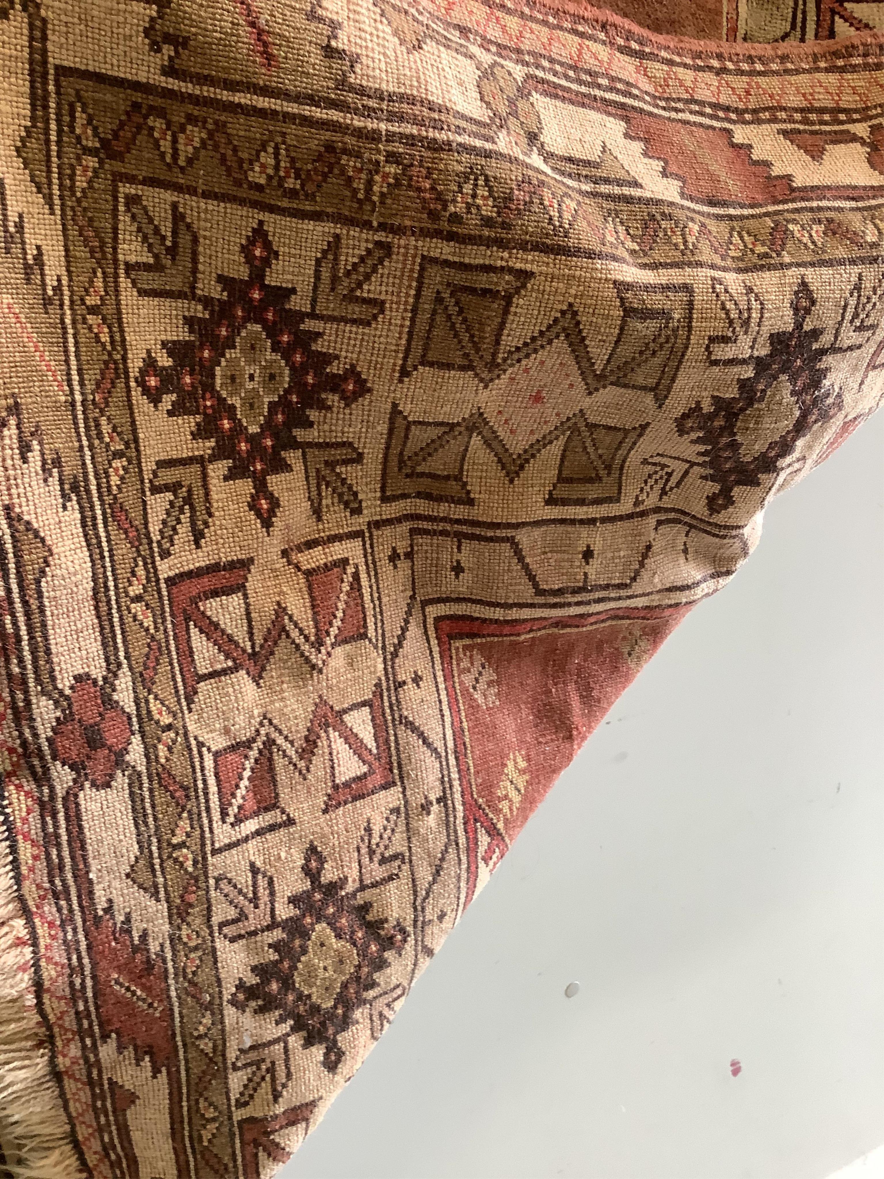A Caucasian design red ground prayer rug, 193 x 124cm
